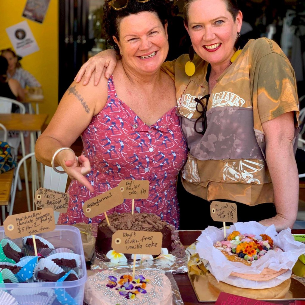Bake sale supporter Rhyll greets Chrysalis Projects' Carmel Haugh